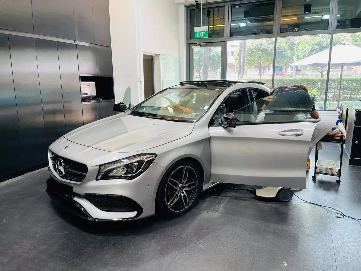Silver Mercedes-Benz CLA with door open before window tinting at Infratint Singapore