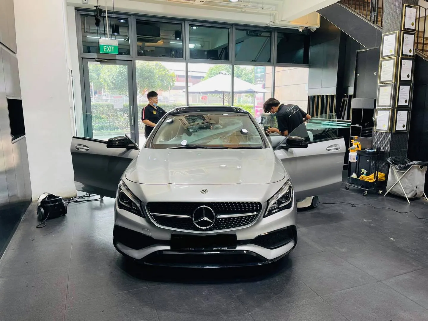 Front view of a silver Mercedes-Benz CLA during window tinting at Infratint Singapore