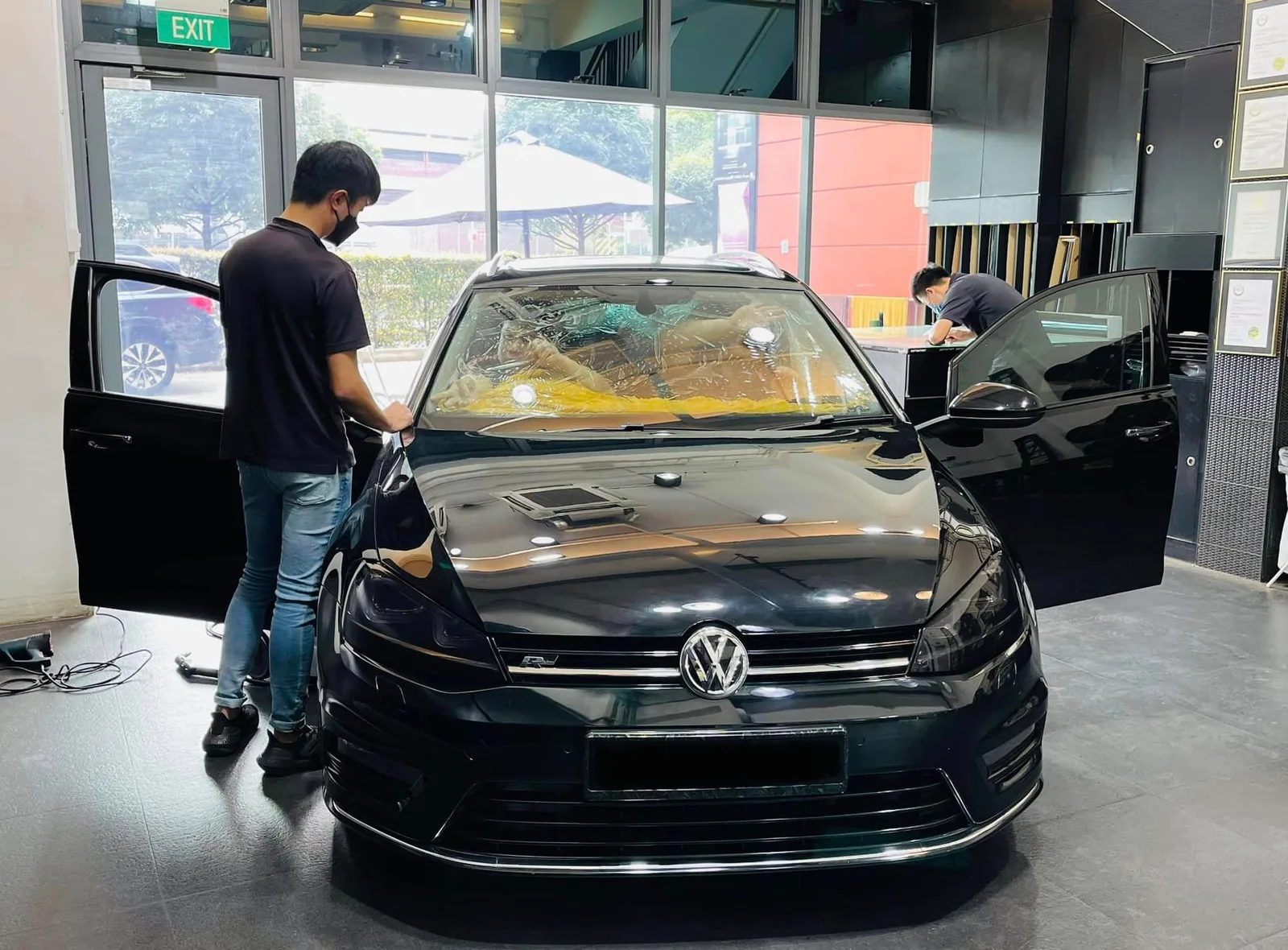 Black Volkswagen Golf being tinted at Infratint Singapore