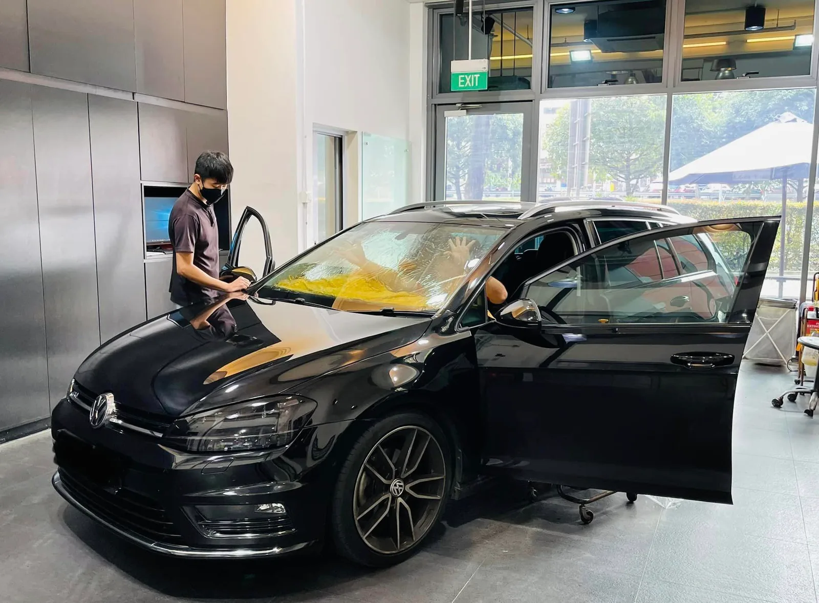 Black Volkswagen Golf having window film applied at Infratint Singapore