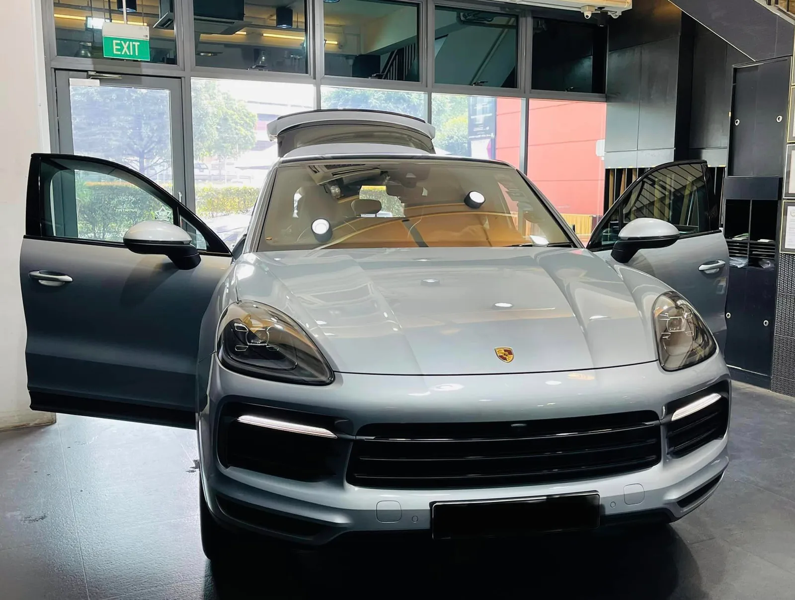 Grey Porsche Cayenne open for window tinting at Infratint Singapore