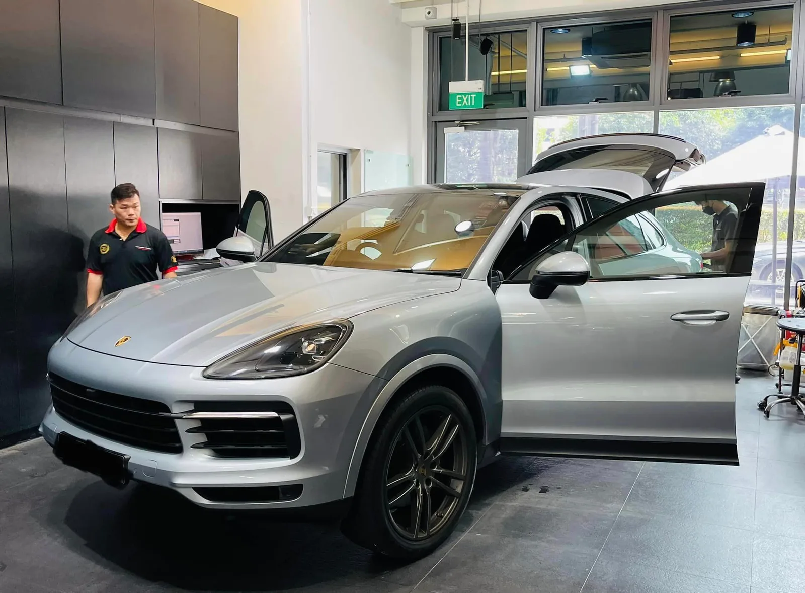Grey Porsche Cayenne being prepared for window film at Infratint Singapore
