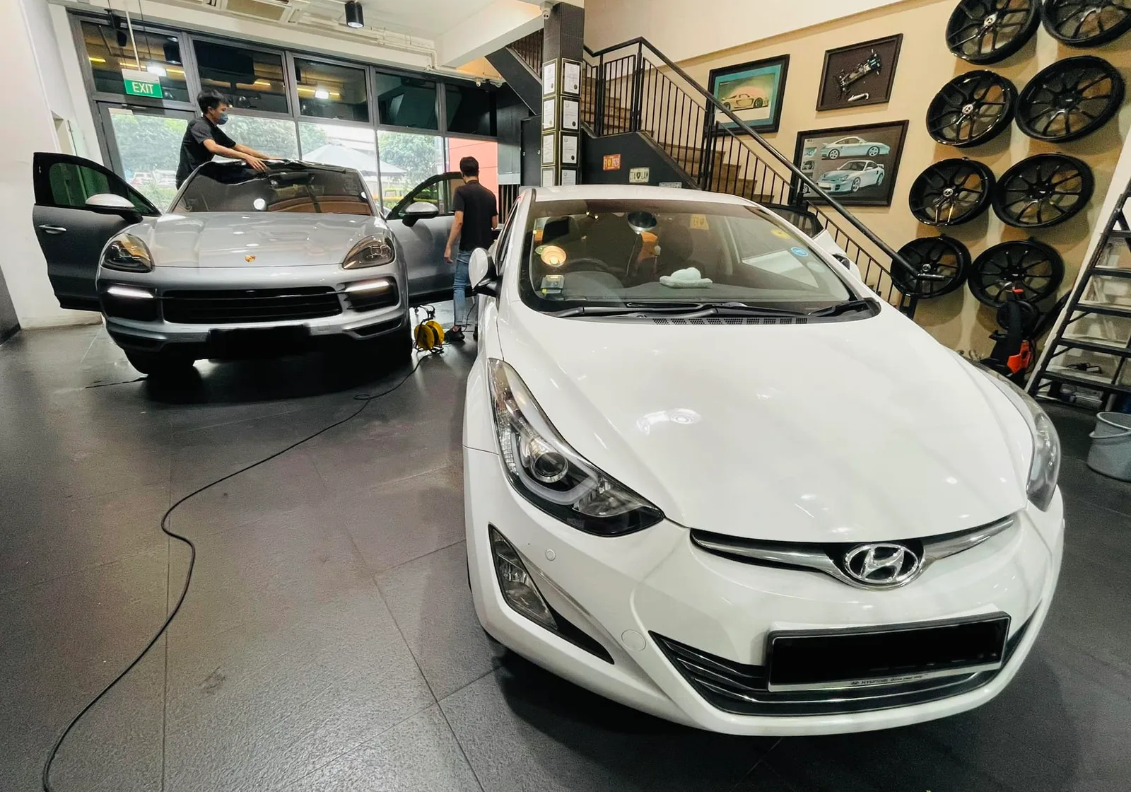 White Hyundai Elantra and grey Porsche Cayenne at Infratint Singapore