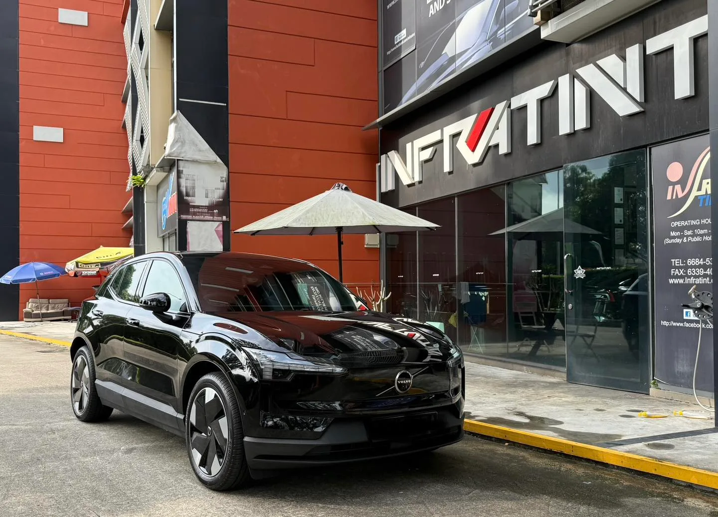 Tinted black Volvo EX30 front three-quarter view at Infratint Singapore