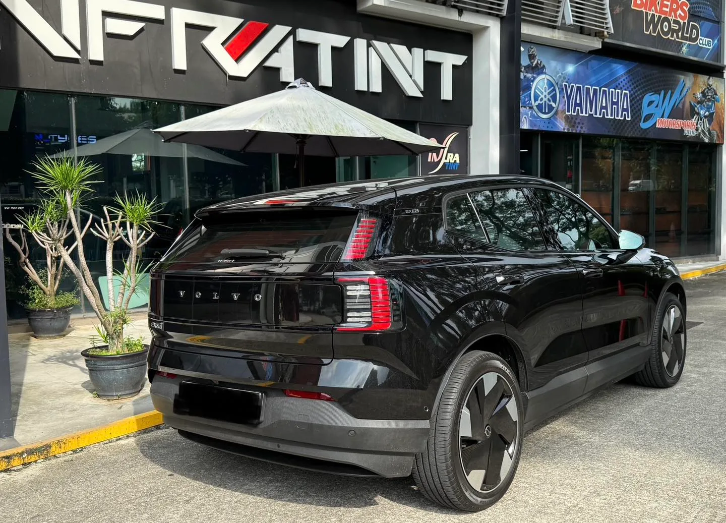 Tinted black Volvo EX30 rear three-quarter view at Infratint Singapore