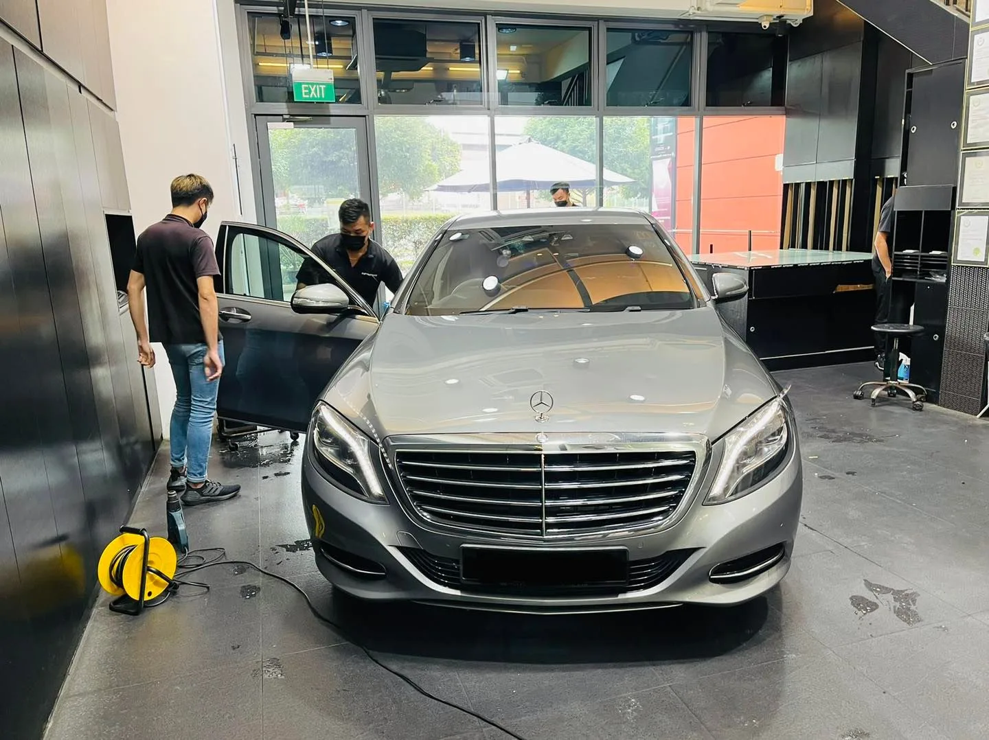Silver Mercedes-Benz S-Class being prepared for window tinting at Infratint Singapore