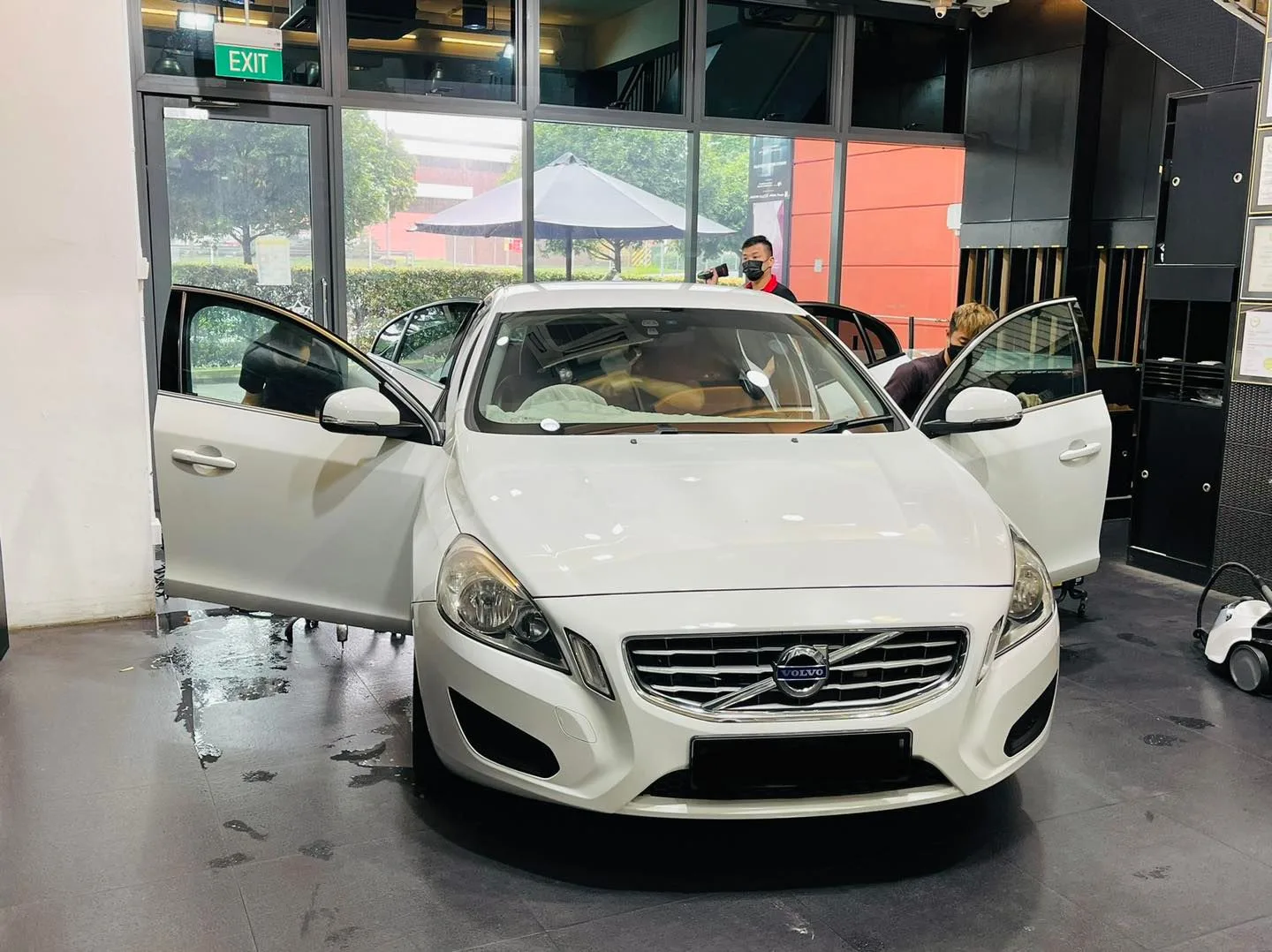 White Volvo S60 open for window tinting at Infratint Singapore