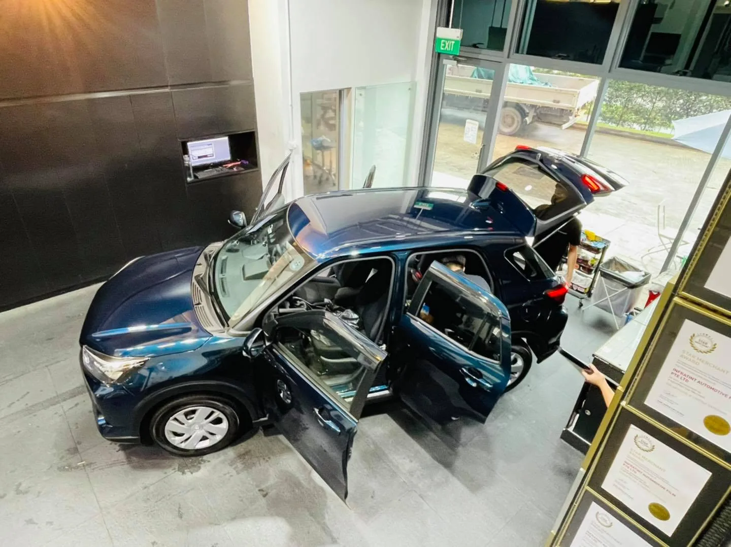Dark blue Toyota Raize seen from above with tailgate open at Infratint Singapore