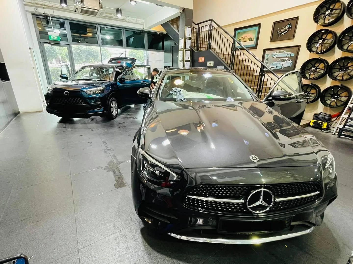 Dark grey Mercedes-Benz sedan front view in the showroom at Infratint Singapore