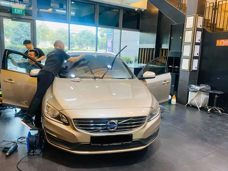 Champagne gold Volvo getting window tint fitted by the team at Infratint Singapore