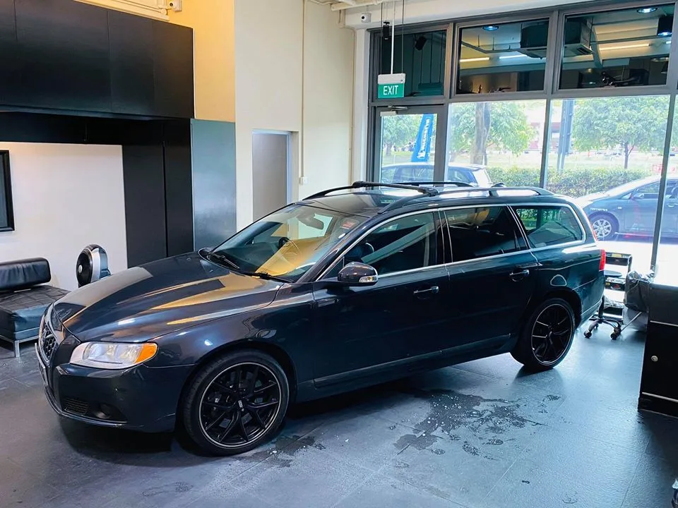Dark grey Volvo V70 wagon with tinted windows at Infratint Singapore