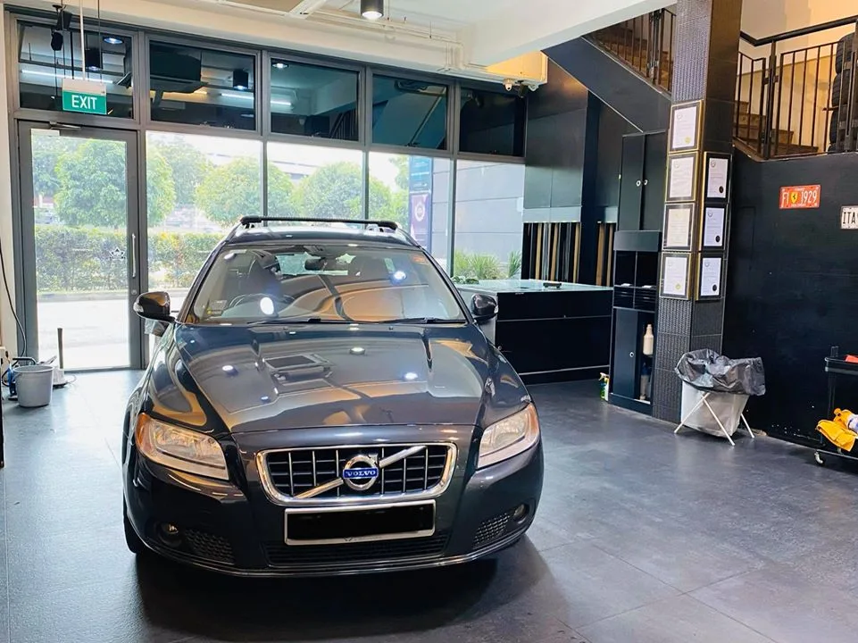 Dark grey Volvo V70 wagon parked in the showroom at Infratint Singapore