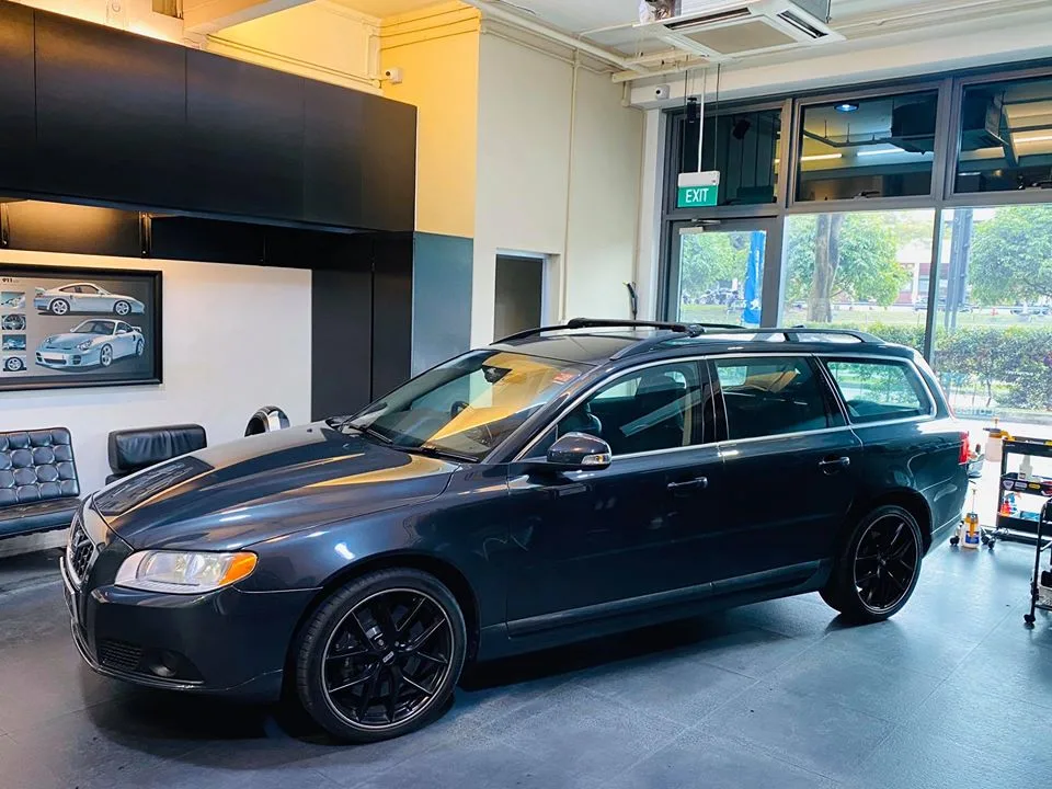 Dark grey Volvo V70 estate on black wheels at Infratint Singapore