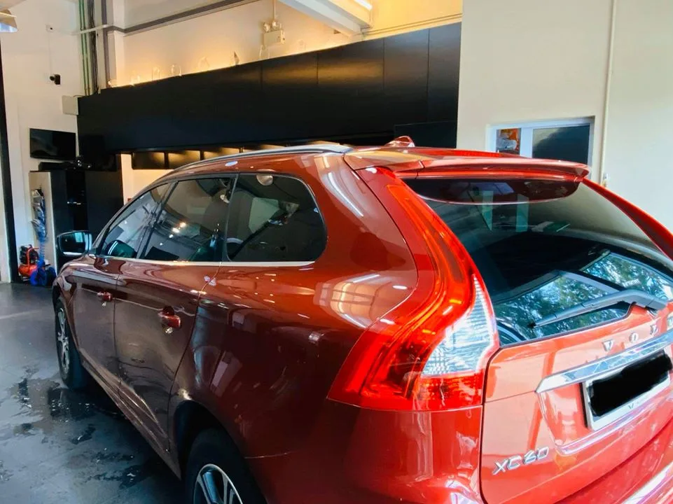 Copper-orange Volvo XC60 side and rear with window film at Infratint Singapore