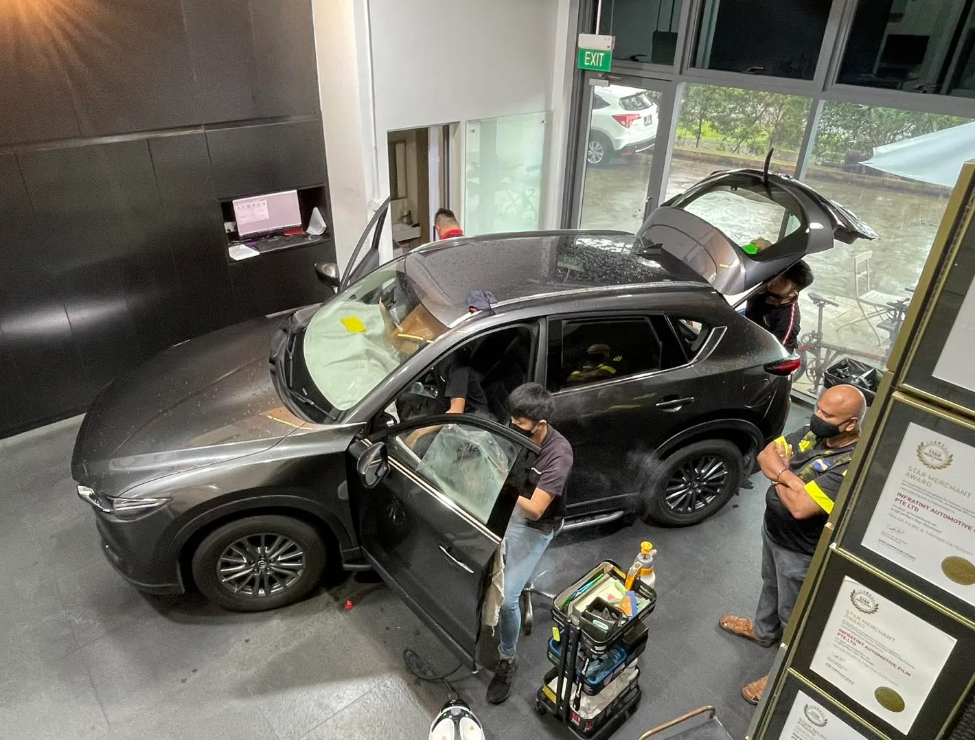 Overhead view of a grey Mazda CX-5 being tinted at Infratint Singapore