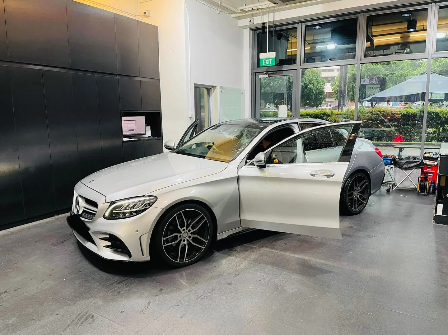 Silver Mercedes-Benz C-Class with doors open during window tinting at Infratint Singapore