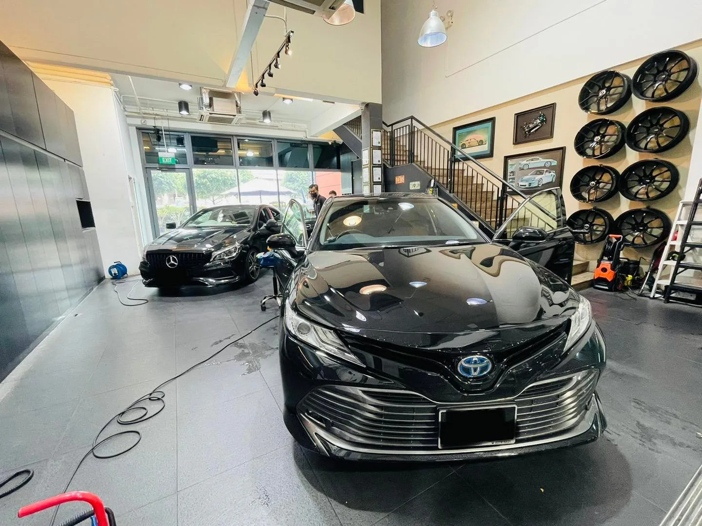 Black Toyota Camry and grey Mercedes-Benz at Infratint Singapore for window tinting