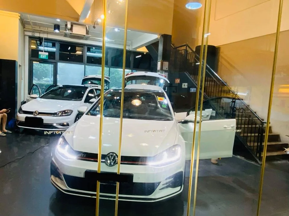 White Volkswagen Golf GTI inside Infratint Singapore for window tinting