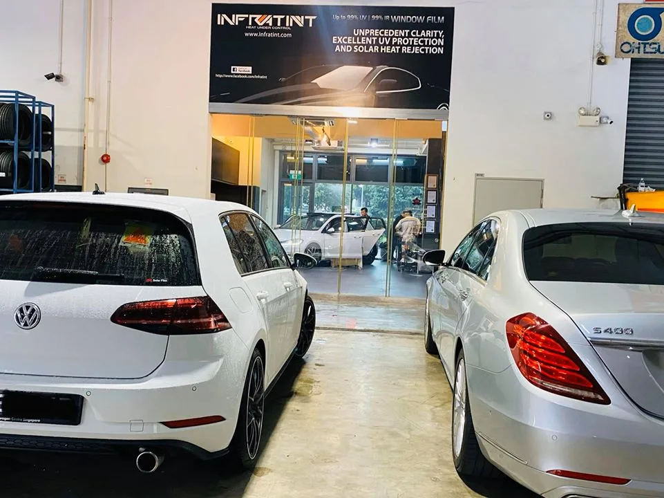 White Volkswagen Golf and silver Mercedes-Benz S400 at Infratint Singapore