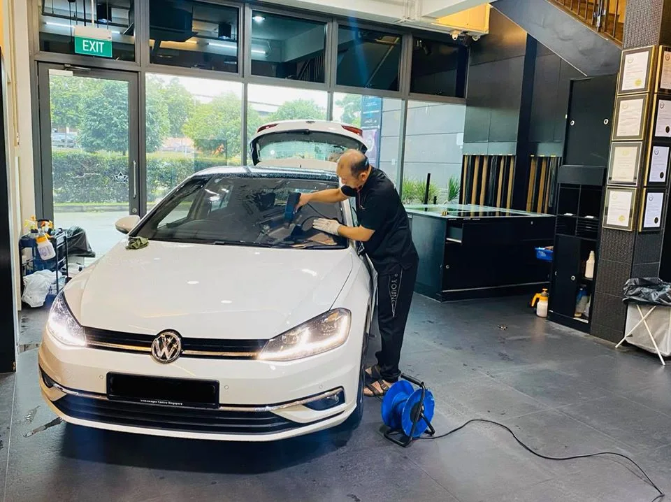 White Volkswagen Golf having its windscreen tinted at Infratint Singapore