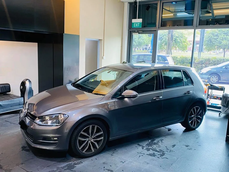 Grey Volkswagen Golf side profile after window tinting at Infratint Singapore