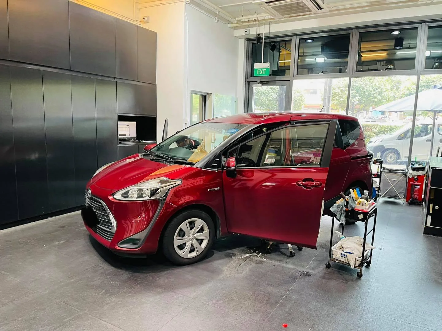 Red Toyota Sienta MPV at Infratint Singapore for window tinting