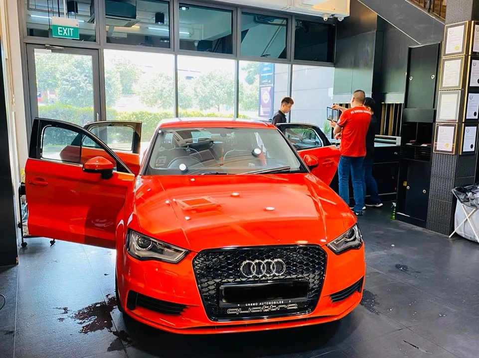 Red Audi A3 quattro front view during window tinting at Infratint Singapore