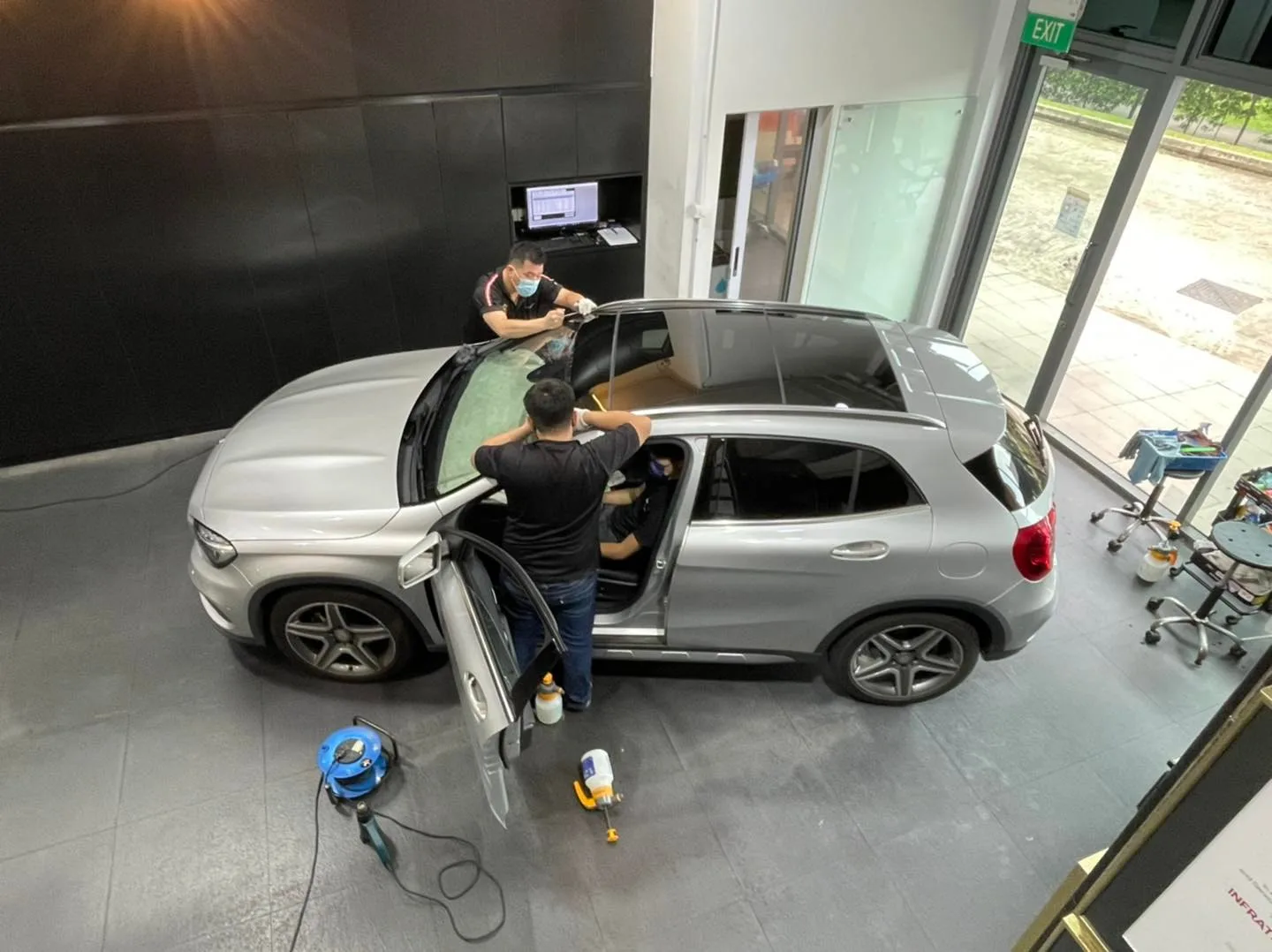 Overhead view of a silver Mercedes-Benz GLA being tinted at Infratint Singapore