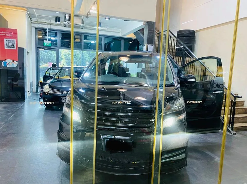 Black Toyota Vellfire MPV inside the Infratint Singapore showroom for window film