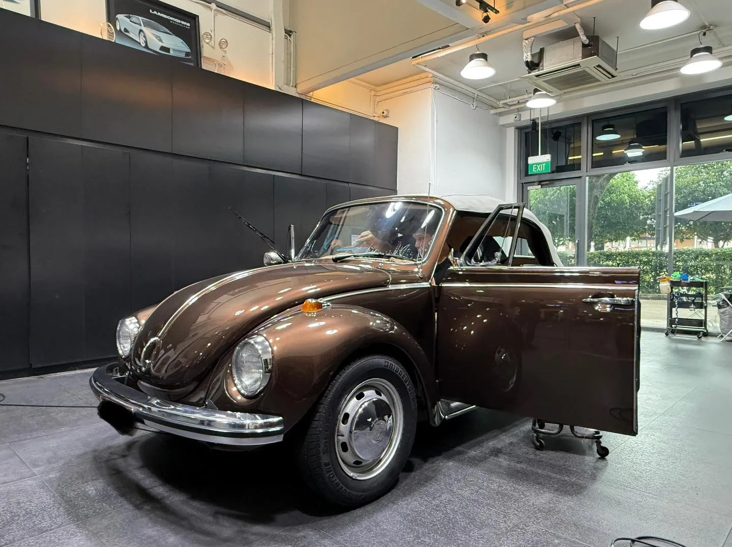 Volkswagen Beetle convertible front three-quarter inside the Infratint workshop
