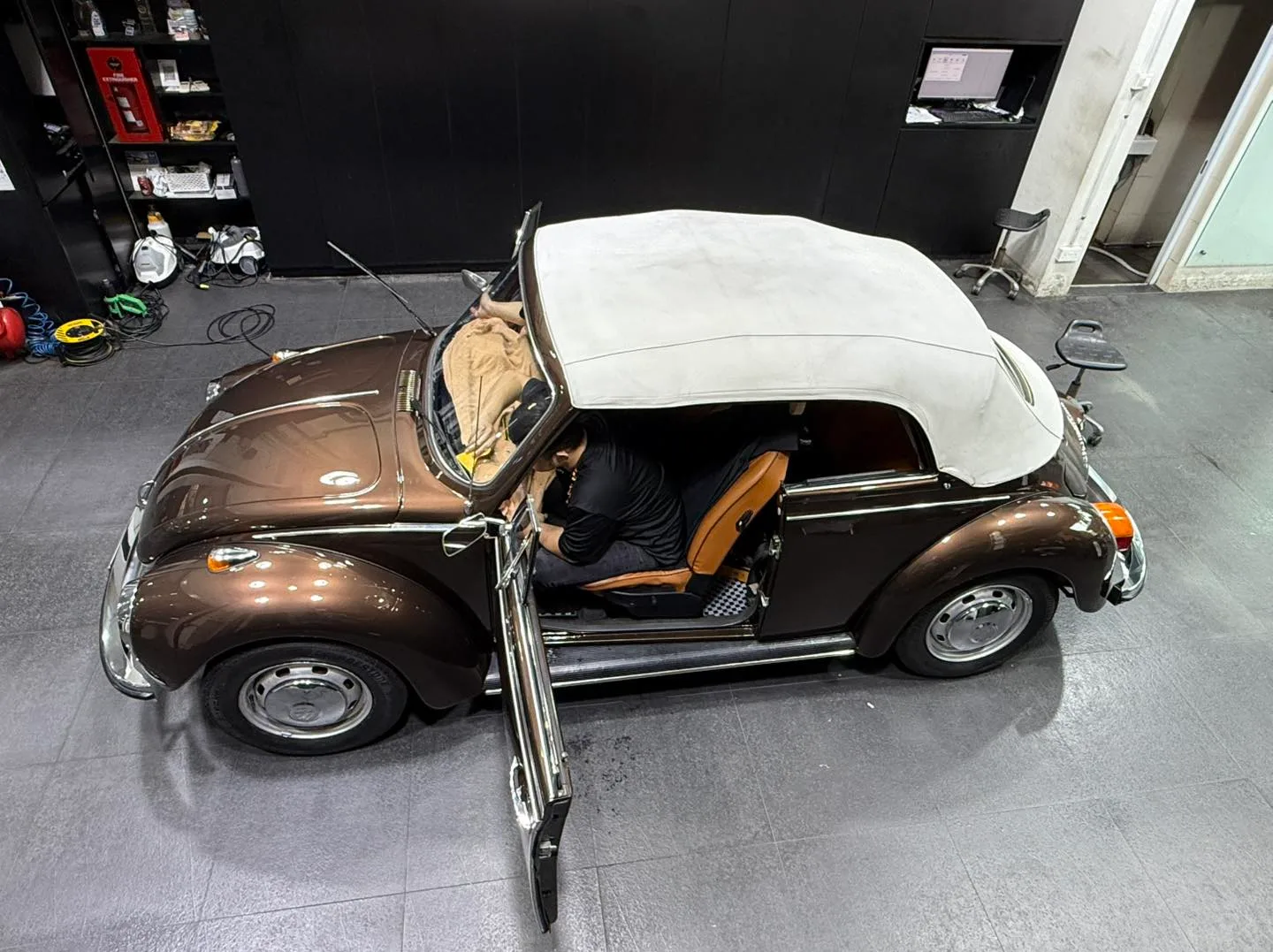 Overhead view of Volkswagen Beetle convertible during window film install at Infratint Singapore