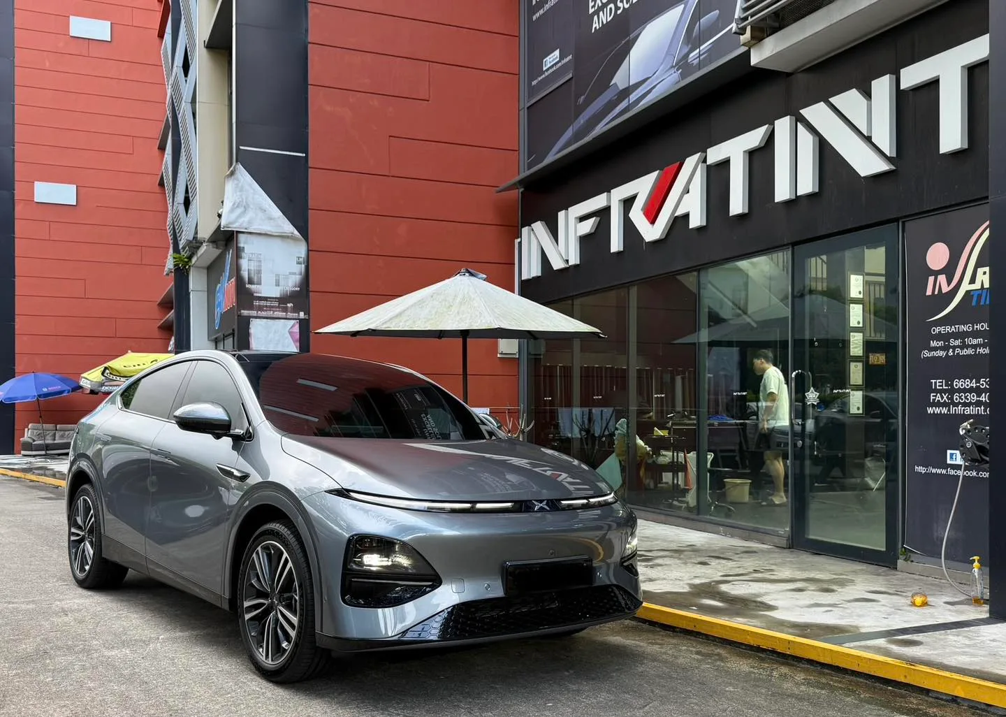 Grey XPENG G6 front three-quarter view outside Infratint Singapore