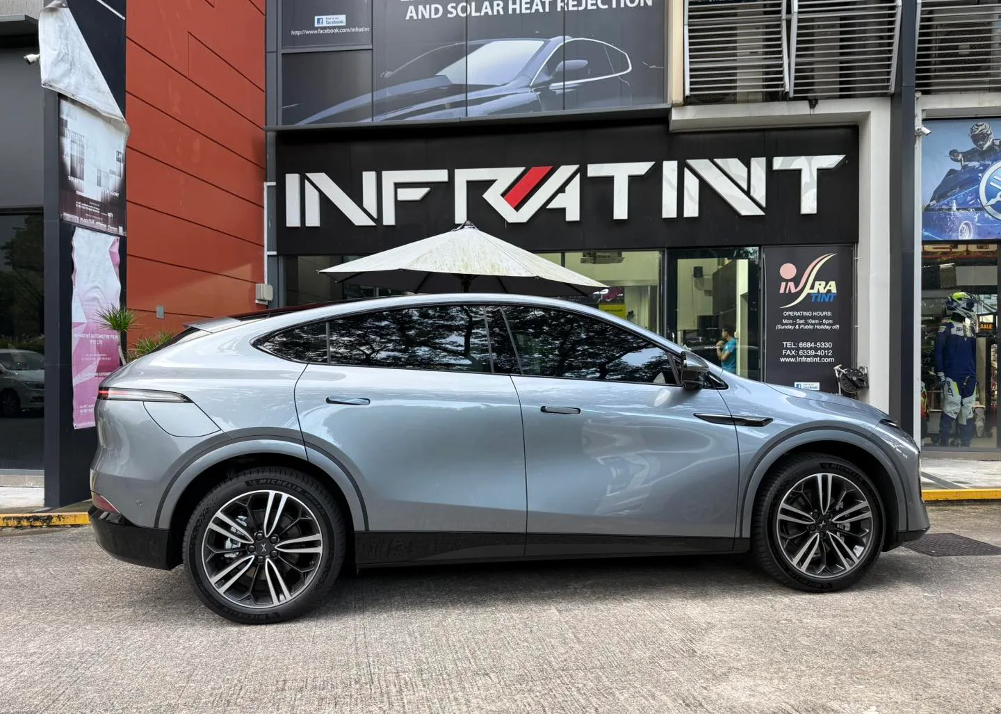 Grey XPENG G6 side profile outside Infratint Singapore