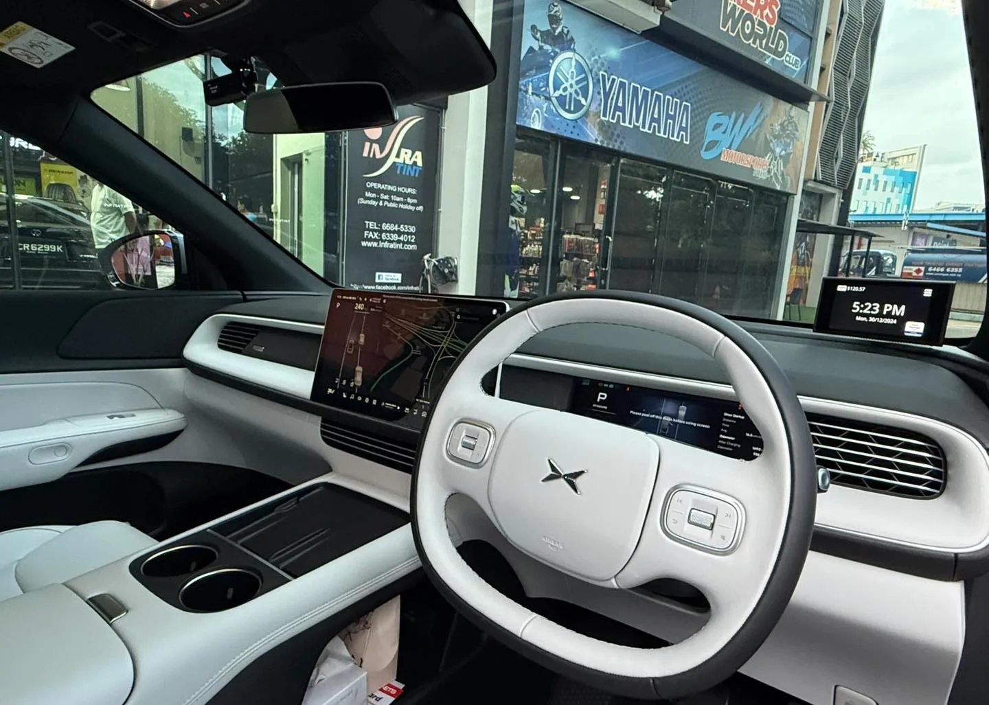 XPENG G6 white interior seen through tinted windscreen at Infratint Singapore