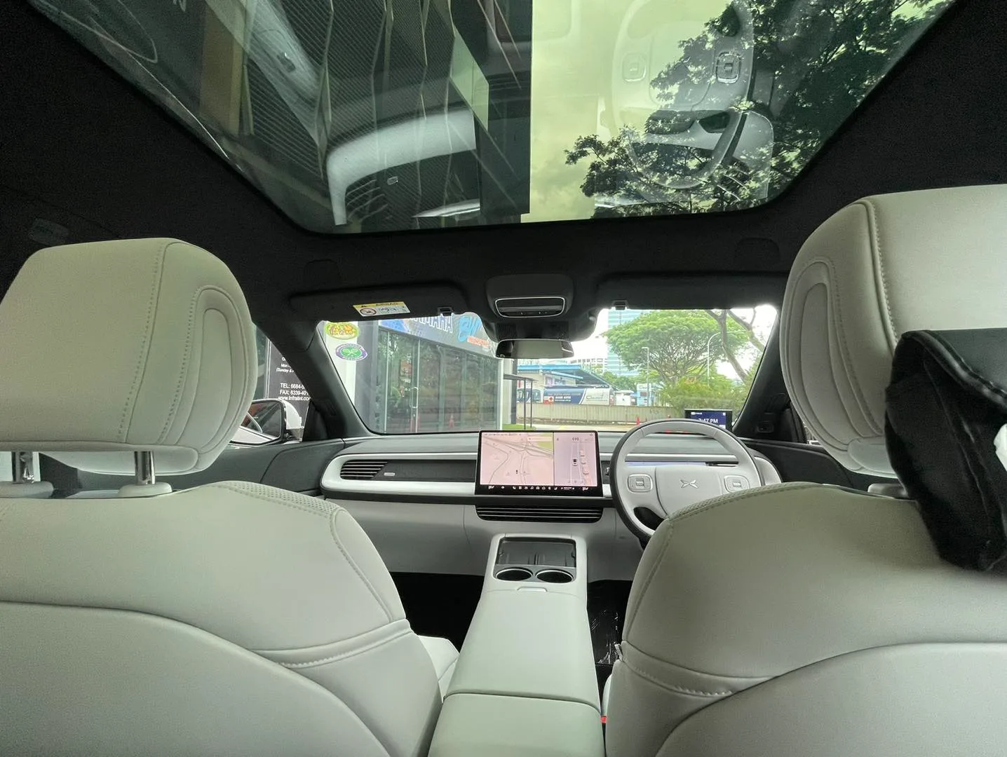 XPENG G6 cream interior and panoramic glass roof at Infratint Singapore