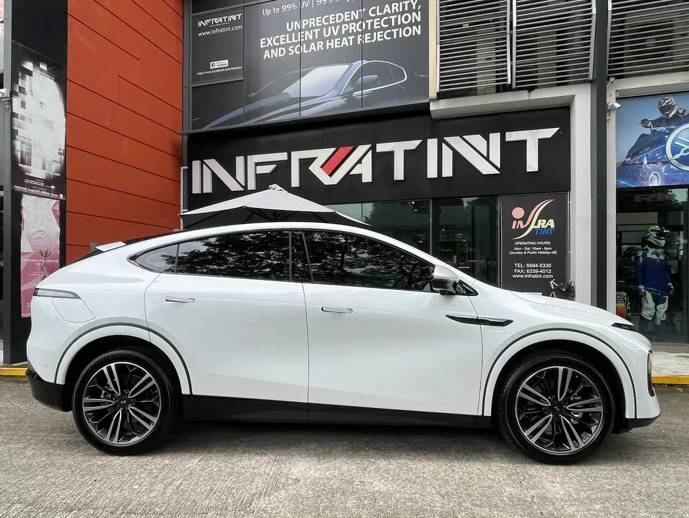 White XPENG G6 side profile outside Infratint Singapore