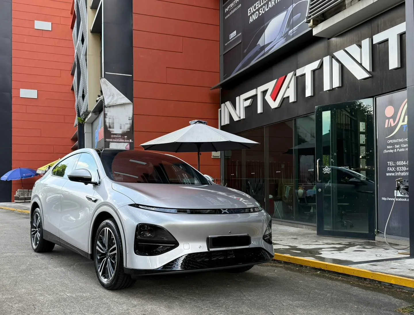 Silver XPENG G6 front three-quarter view with tinted windows at Infratint Singapore