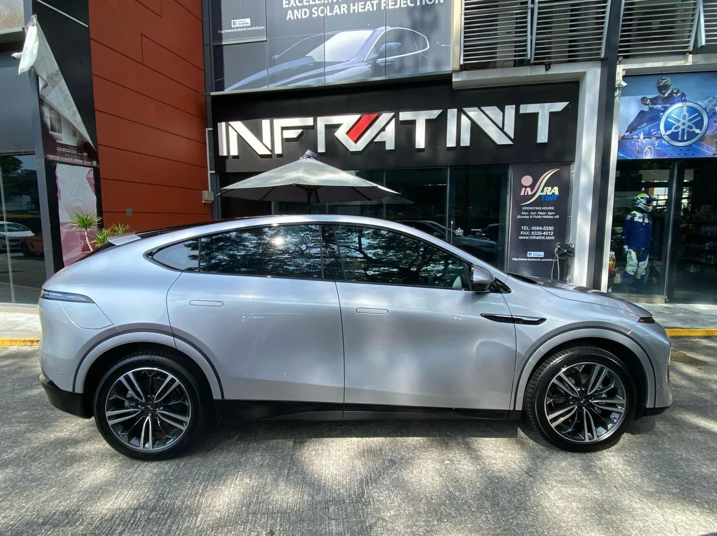Silver XPENG G6 side profile with tinted windows at Infratint Singapore