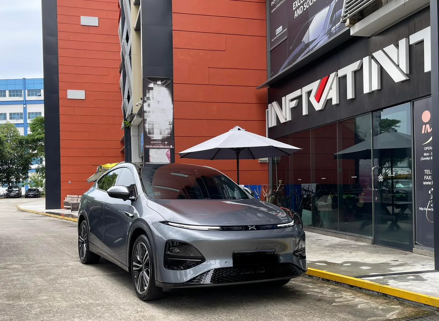 Grey XPENG G6 front three-quarter view with tinted glass at Infratint Singapore