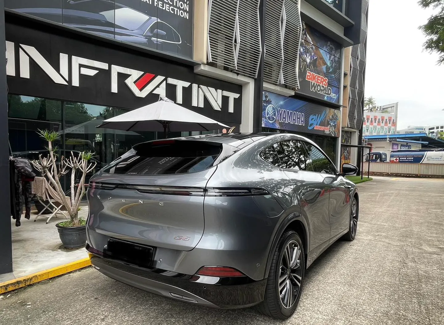 Grey XPENG G6 rear three-quarter view with tinted glass at Infratint Singapore