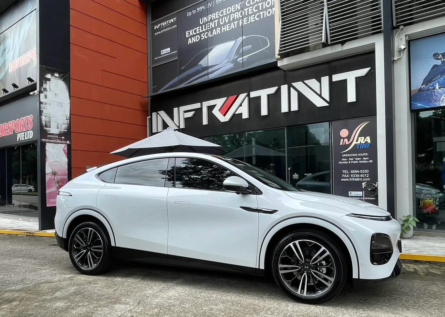 White XPENG G6 side profile with tinted glass at Infratint Singapore