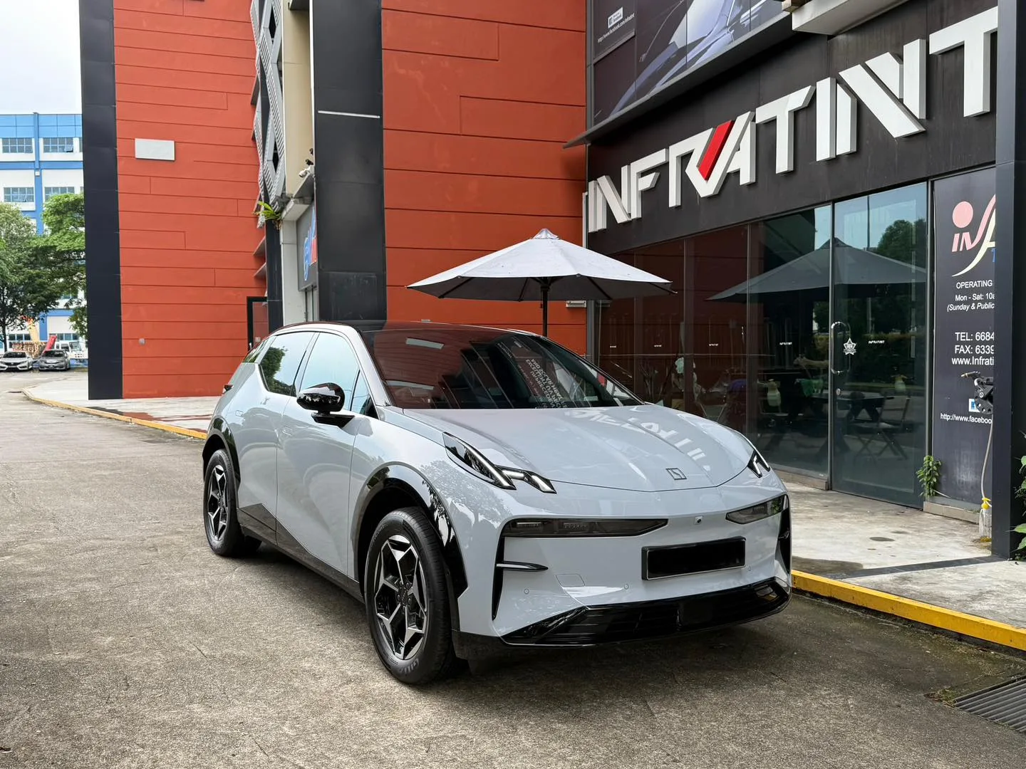Pale grey Zeekr X front three-quarter view outside Infratint Singapore